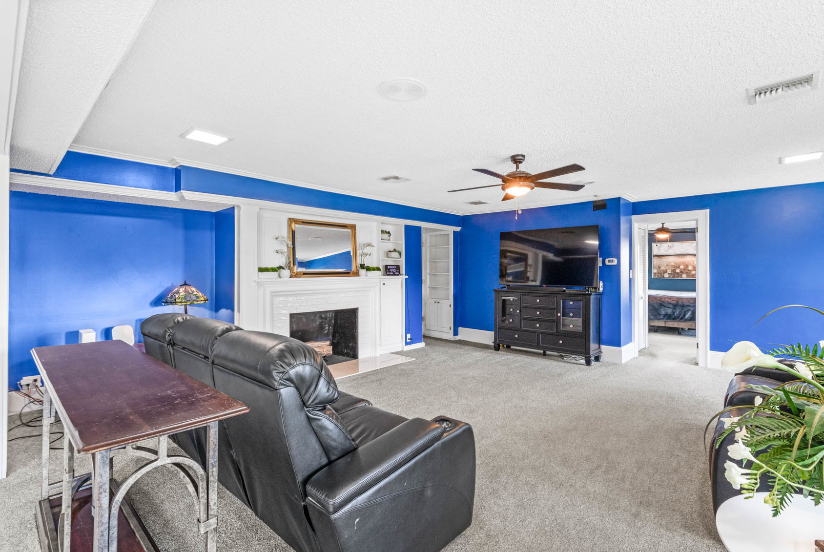 family room with blue walls and couch